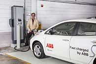 Ken Graber, director of media relations at ABB, charges the company’s Nissan LEAF at the UWM quick-charge station in the Klotsche Center & Pavilion parking structure.